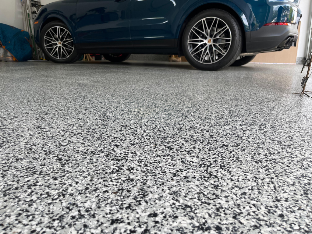 Completed epoxy garage floor transforming a double car garage in Davie