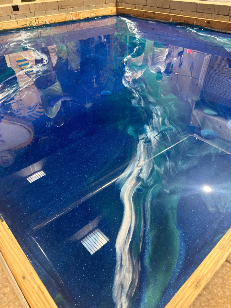 High-performance metallic blue epoxy floor with seamless finish