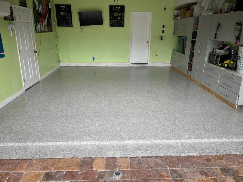 Miami Gardens garage after epoxy floor installation, showcasing durability and modern design.