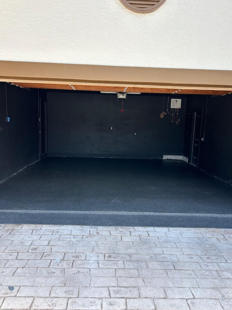 Two-Car Garage Epoxy Coating & Cement Block Removal in Davie, FL | GonzaBuilt Complete view of finished epoxy garage floor at Davie Florida home after GonzaBuilt two-car garage renovation