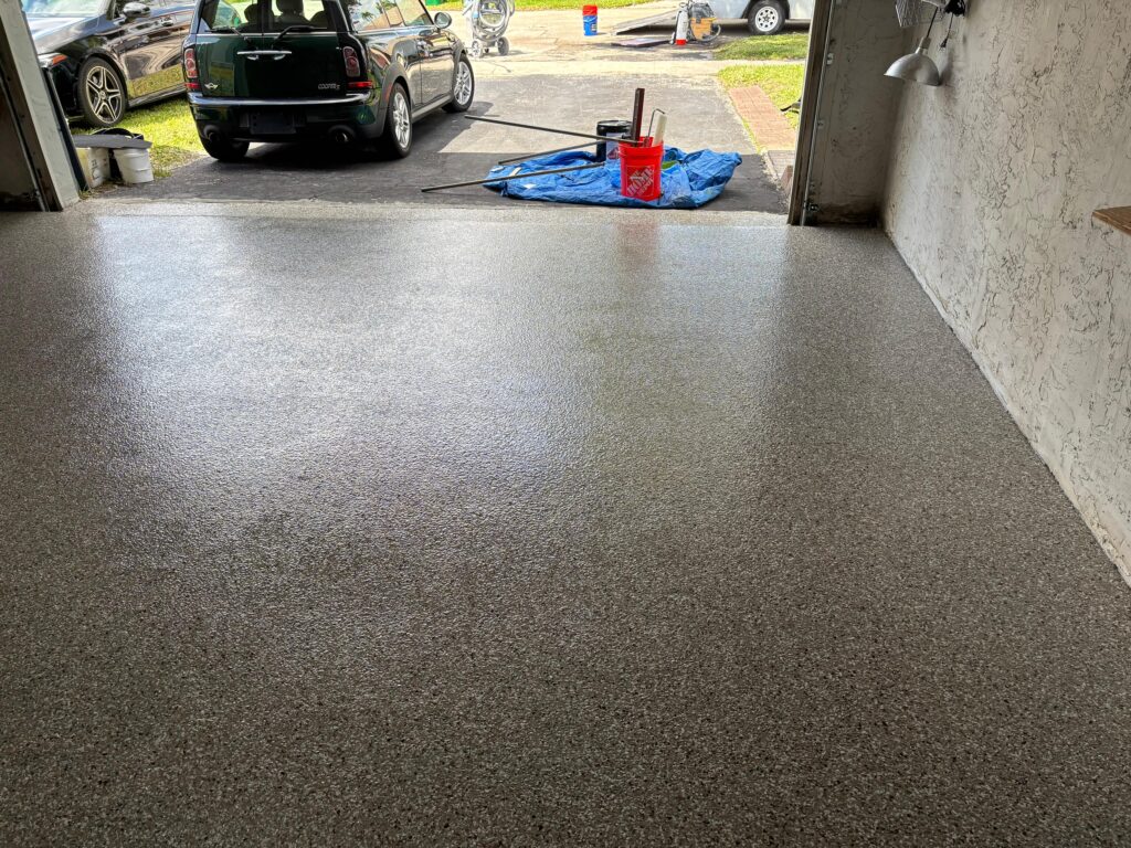 Garage-to-Home Salon Epoxy Floor in Coral Springs, FL | ¼" Creekbed Flake Mix Finished ¼" Creekbed flake epoxy floor in converted home salon garage in Coral Springs, Florida by GonzaBuilt