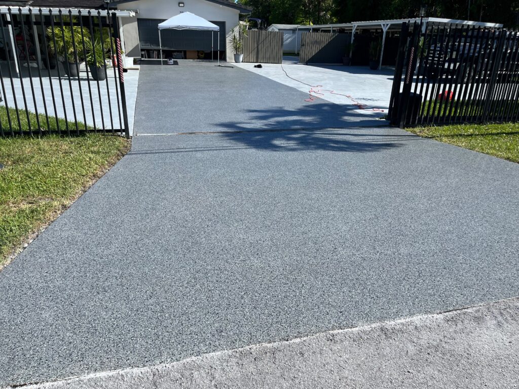 Nightfall Flake Epoxy Driveway & Backyard in North Miami Beach, FL | GonzaBuilt Completed Nightfall flake epoxy driveway after professional installation by GonzaBuilt at North Miami Beach, Florida home