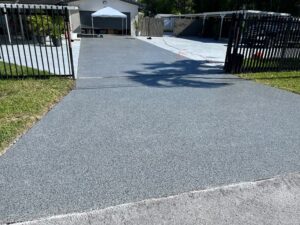 Completed Nightfall flake epoxy driveway after professional installation by GonzaBuilt at North Miami Beach, Florida home