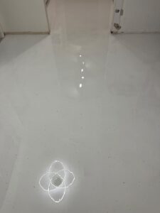 Completed glossy white terrazzo epoxy finish covering entire home interior after professional installation by GonzaBuilt in Hollywood, Florida